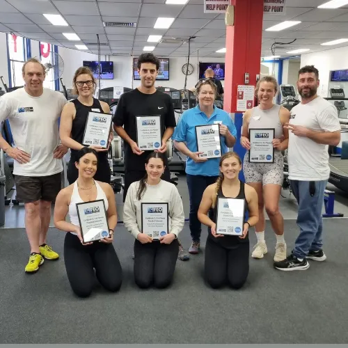 Happy fitness professionals after being certified